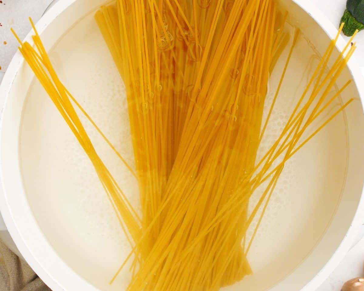 Spaghetti in a pot of water.