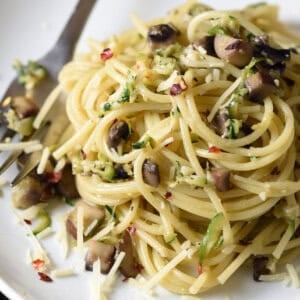 pile of pasta with chopped zucchini and mushrooms