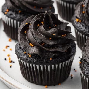 Black velvet cupcakes on a white tray