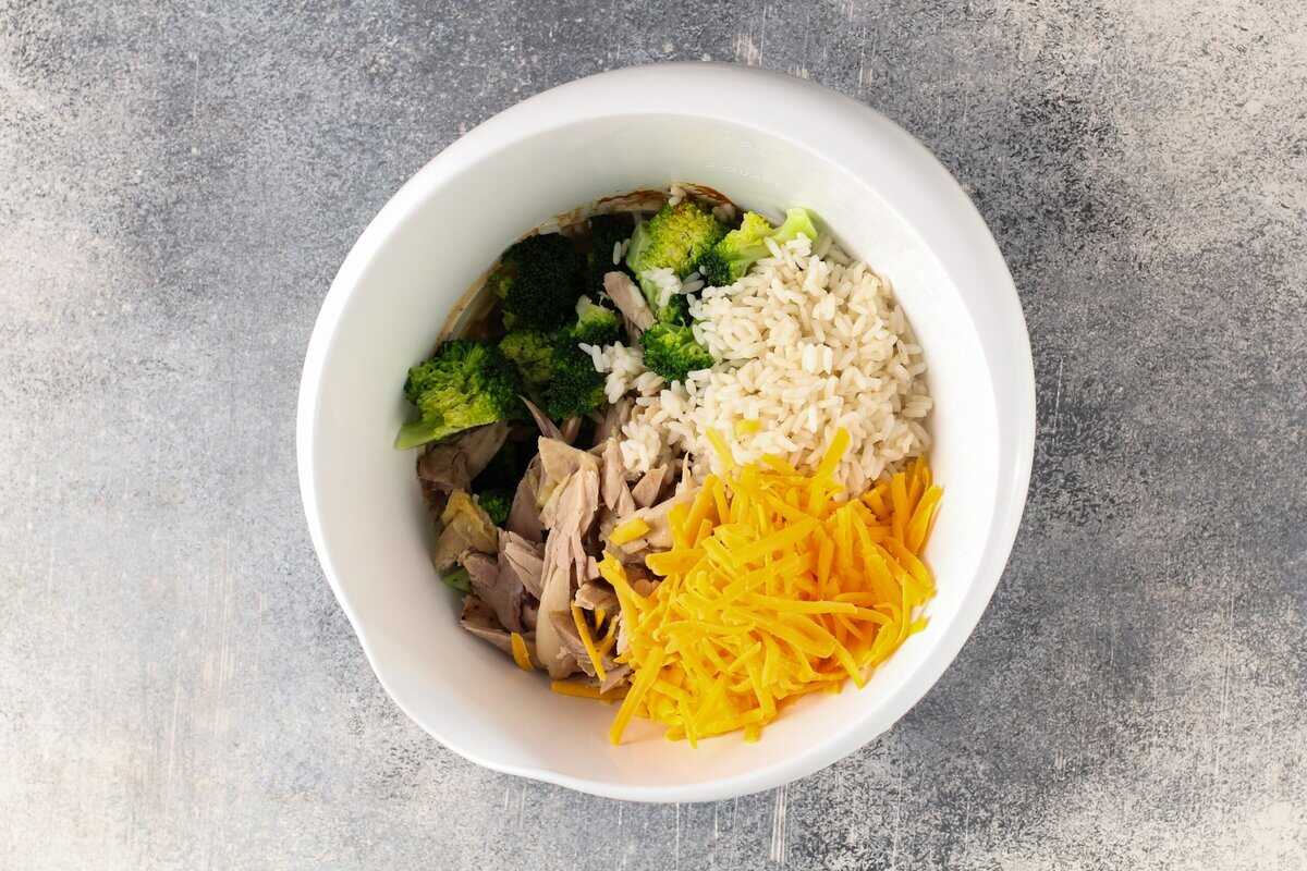 Ingredients to make the chicken and broccoli rice casserole in a white bowl.