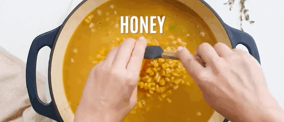 Adding the ingredients to make corn chowder to the pot with the veggies. 