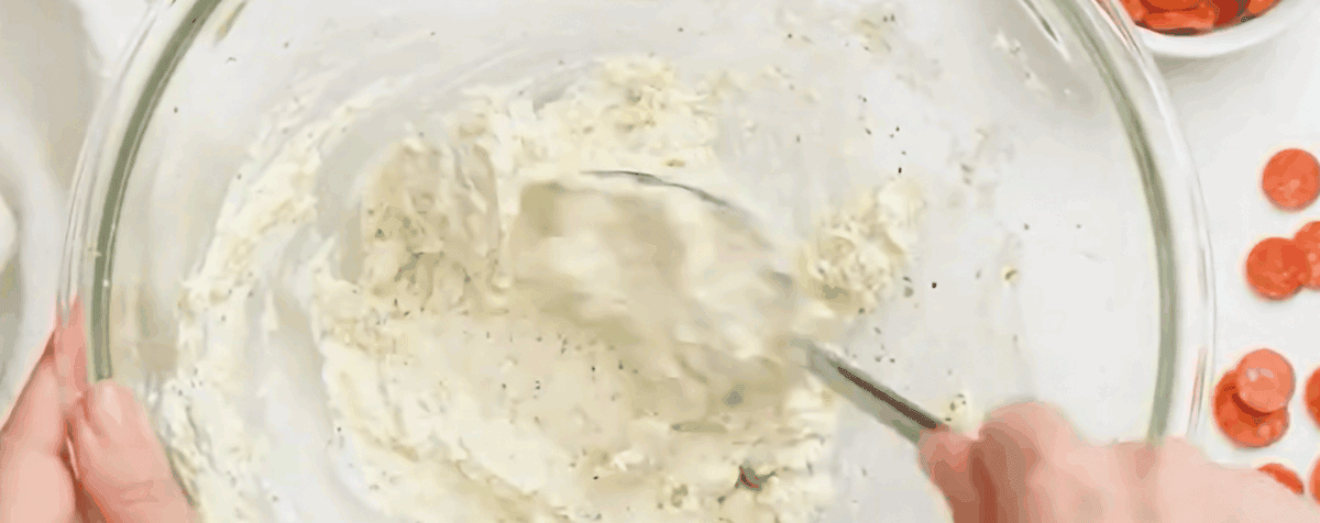 Combining the ingredients for the cheese layer.