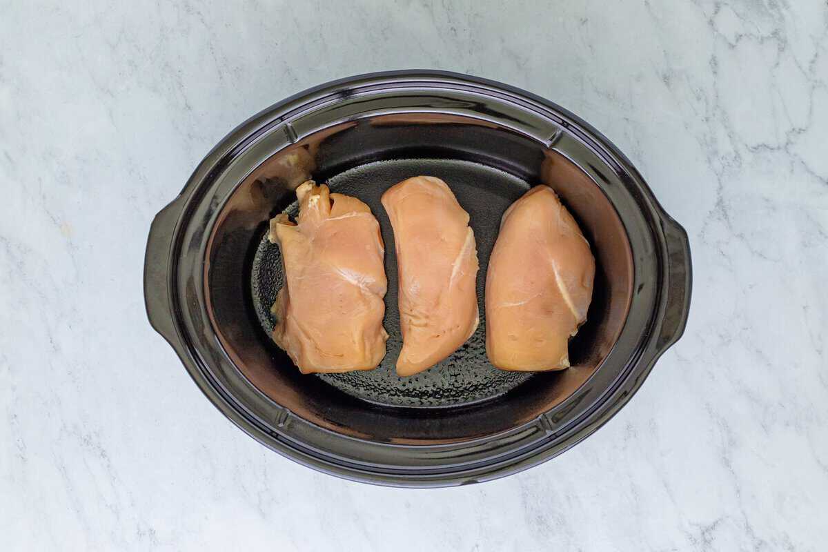 Chicken breasts in a crockpot.