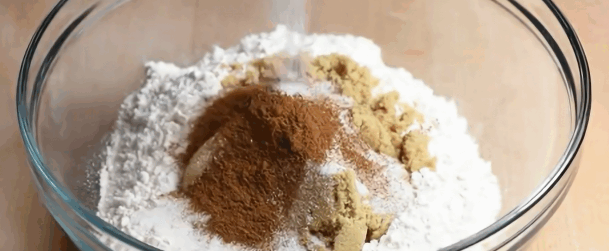 Ingredients for the crumble layers in a glass bowl. 