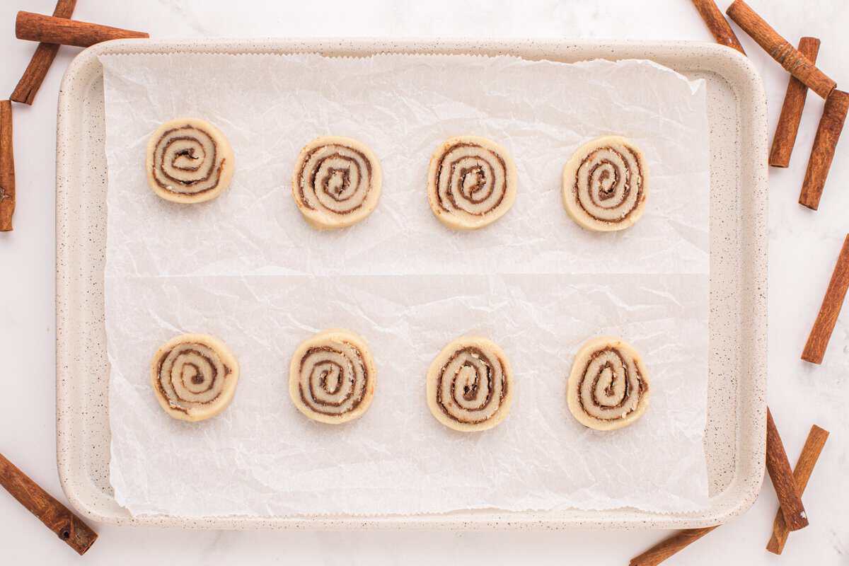 Unbaked cookies on a cookie sheet.