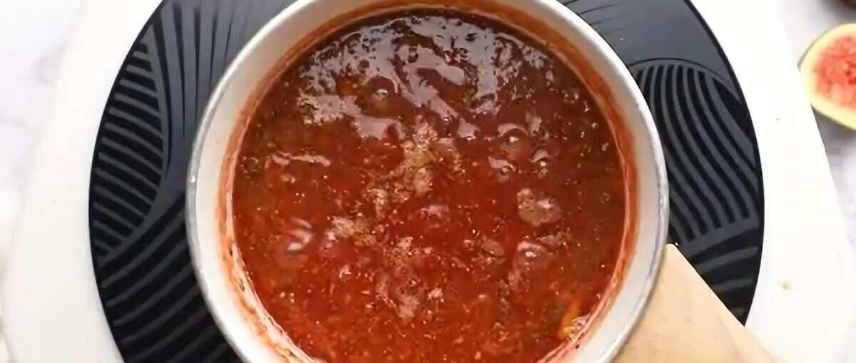 Fig jam simmering in a pot. 