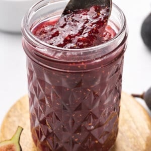 spoon scooping fig jam in jar
