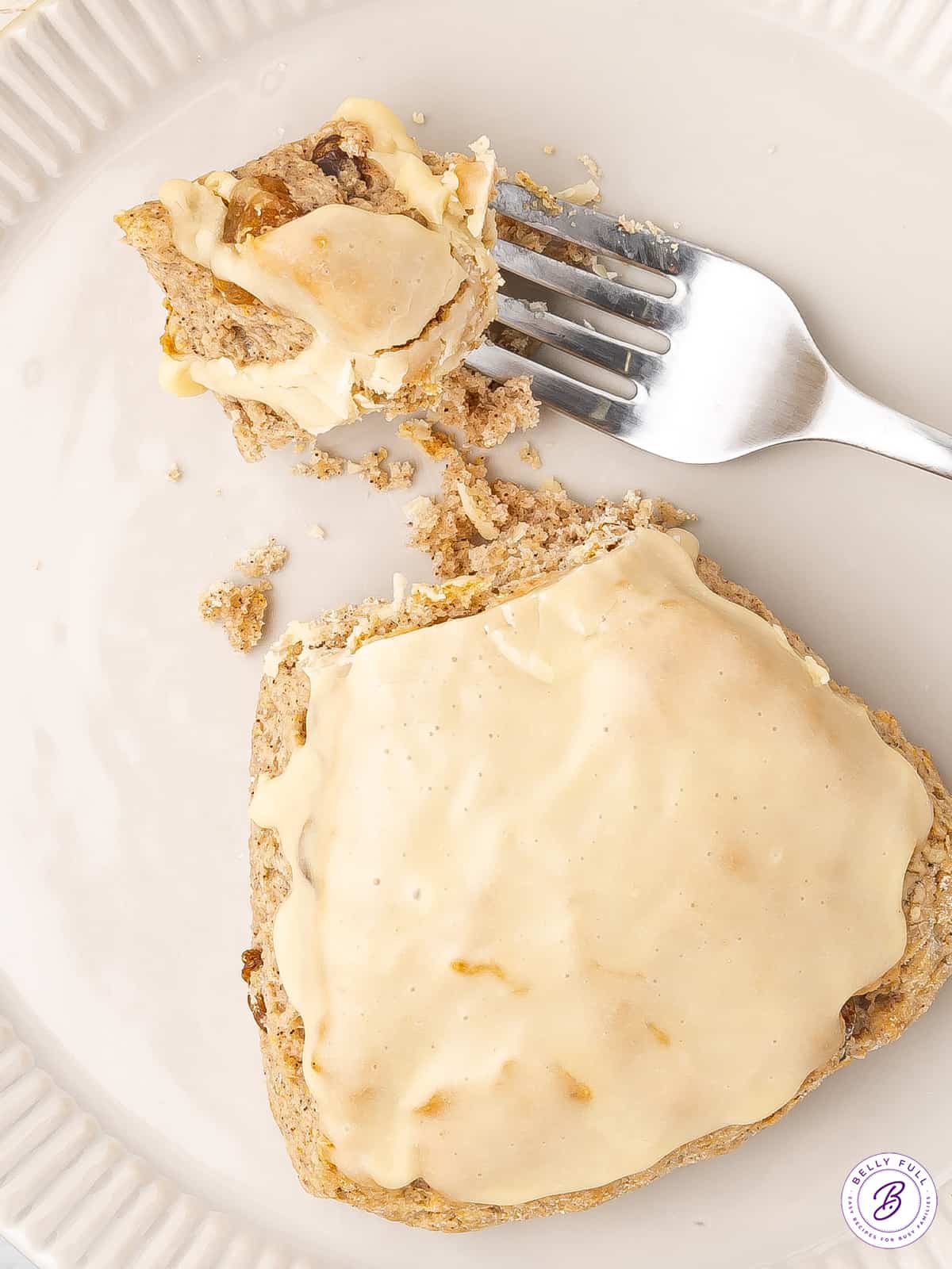 bite of glazed flaky scone on fork