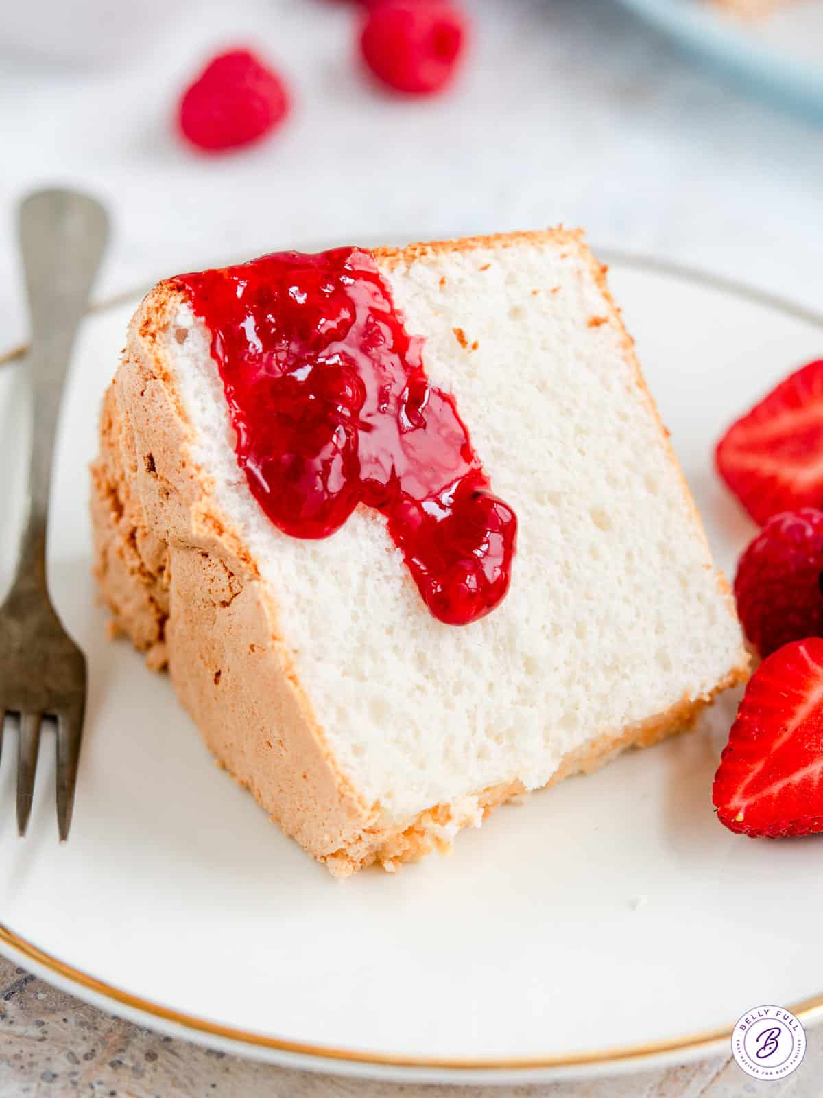 slice of cake with strawberry sauce