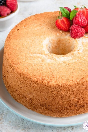 close up round angel food cake on plate