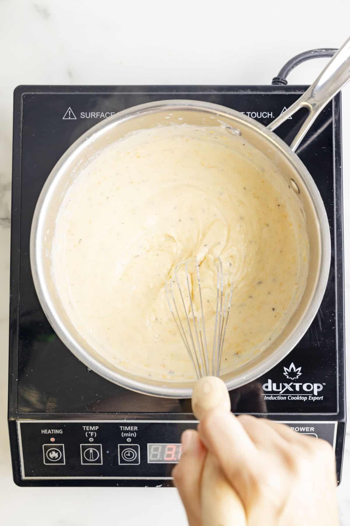Making the bechamel sauce in a pan.