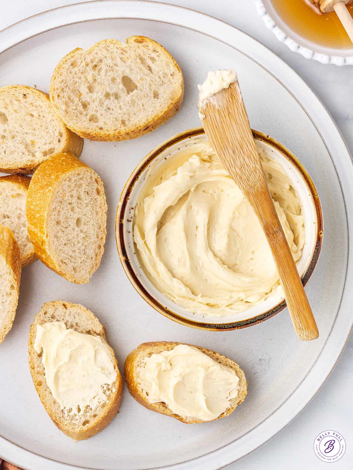 overhead ramekin of butter with butter knife