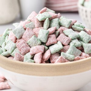 Christmas Muddy Buddies piled high in bowl