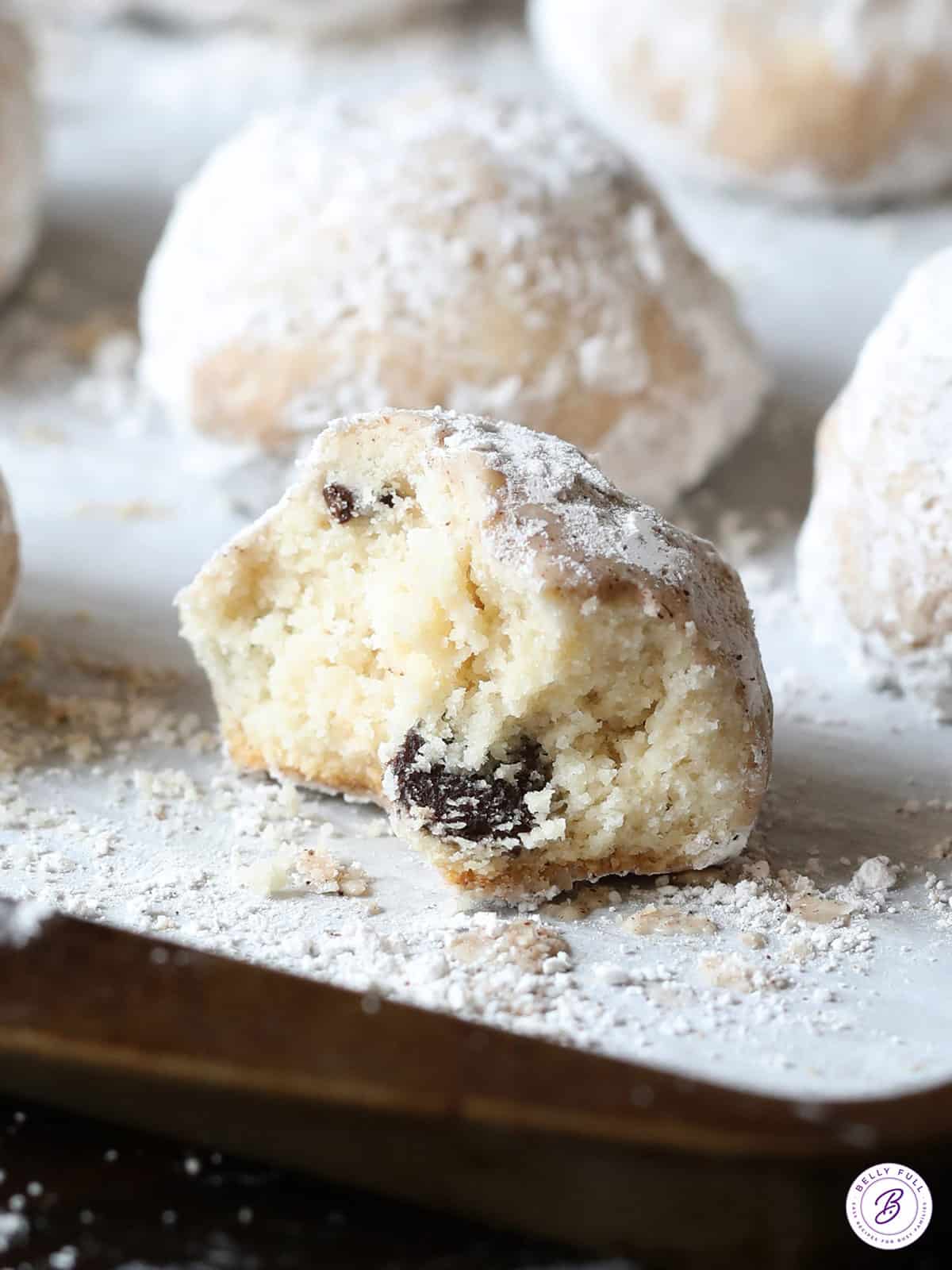 cookie with bite taken on baking sheet