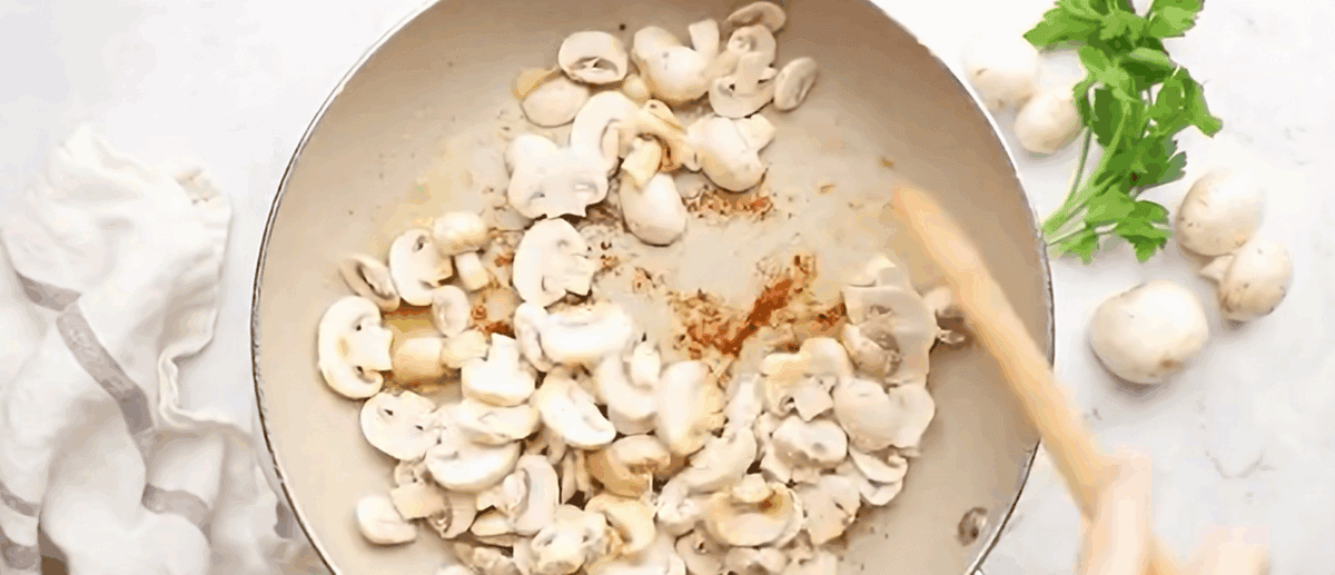 Cooking the mushrooms in a skillet.