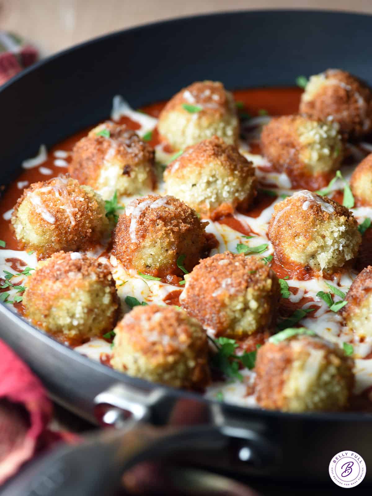 Chicken Parmesan Meatballs in pan with tomato sauce