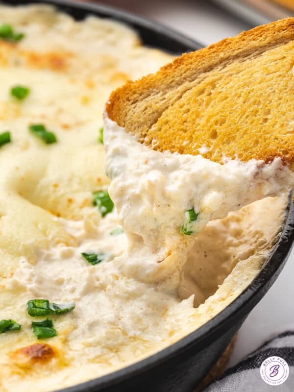 melted crab rangoon dip on toasted bread