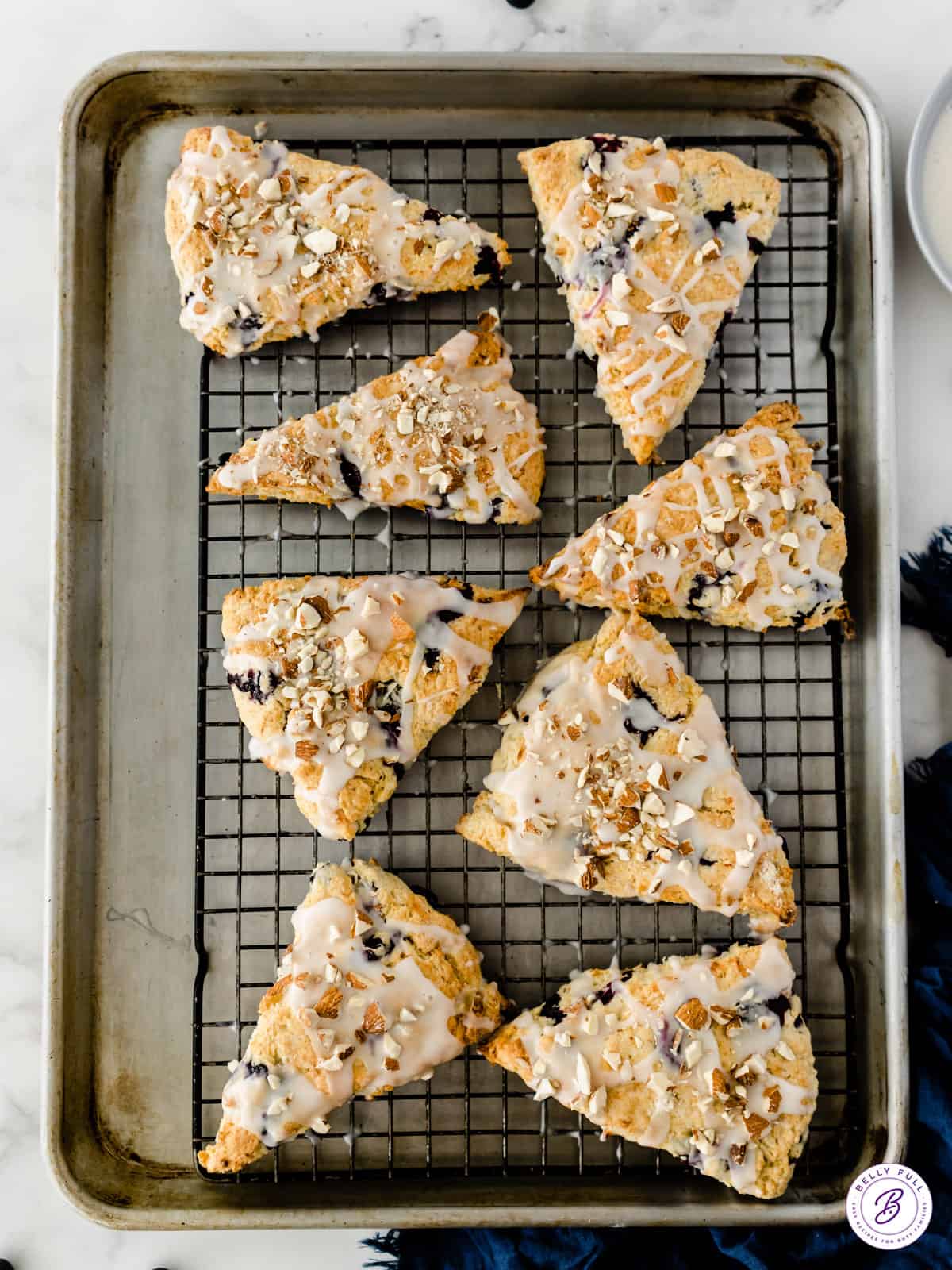 8 triangle glazed scones on baking rack