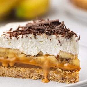 A slice of banoffee pie on a white plate