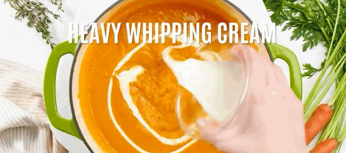 Adding cream to the soup.