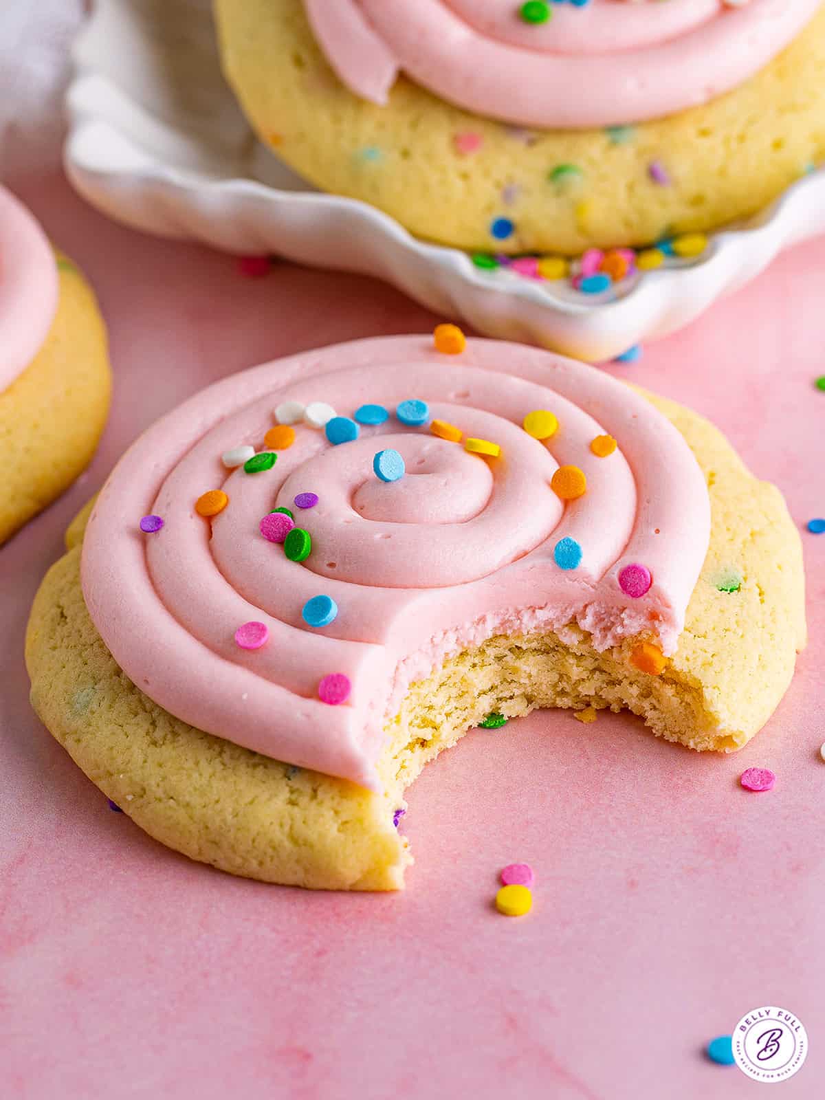 Close up of a Crumbl cookies confetti cookie with a bite missing