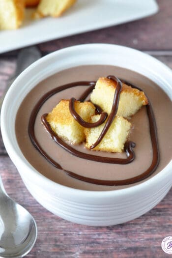 Thickened milk chocolate in dessert cups with cake croutons