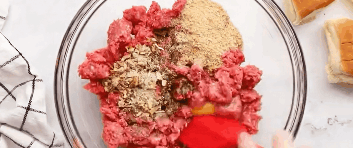 Combining ingredients for ground beef mixture.