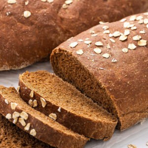 Copycat Cheesecake Factory brown bread with three pieces sliced