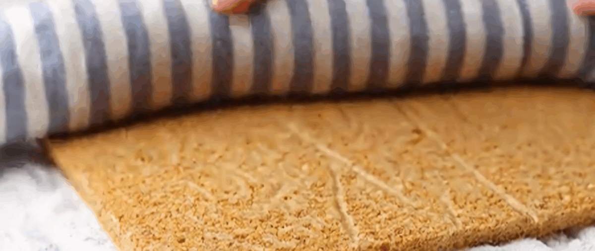 Rolling the cake in a dish towel. 