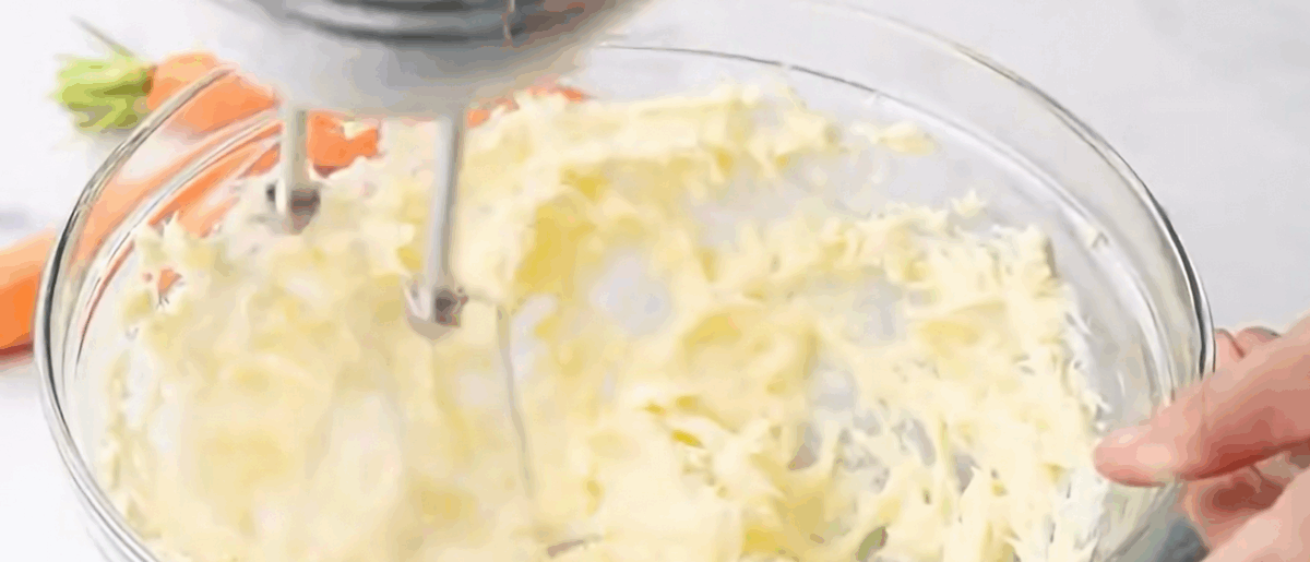 Mixing the ingredients to make the cream cheese filling. 