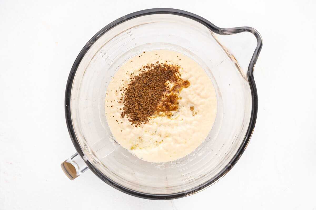 Adding molasses, honey, and instant coffee powder to the yeast mixture.