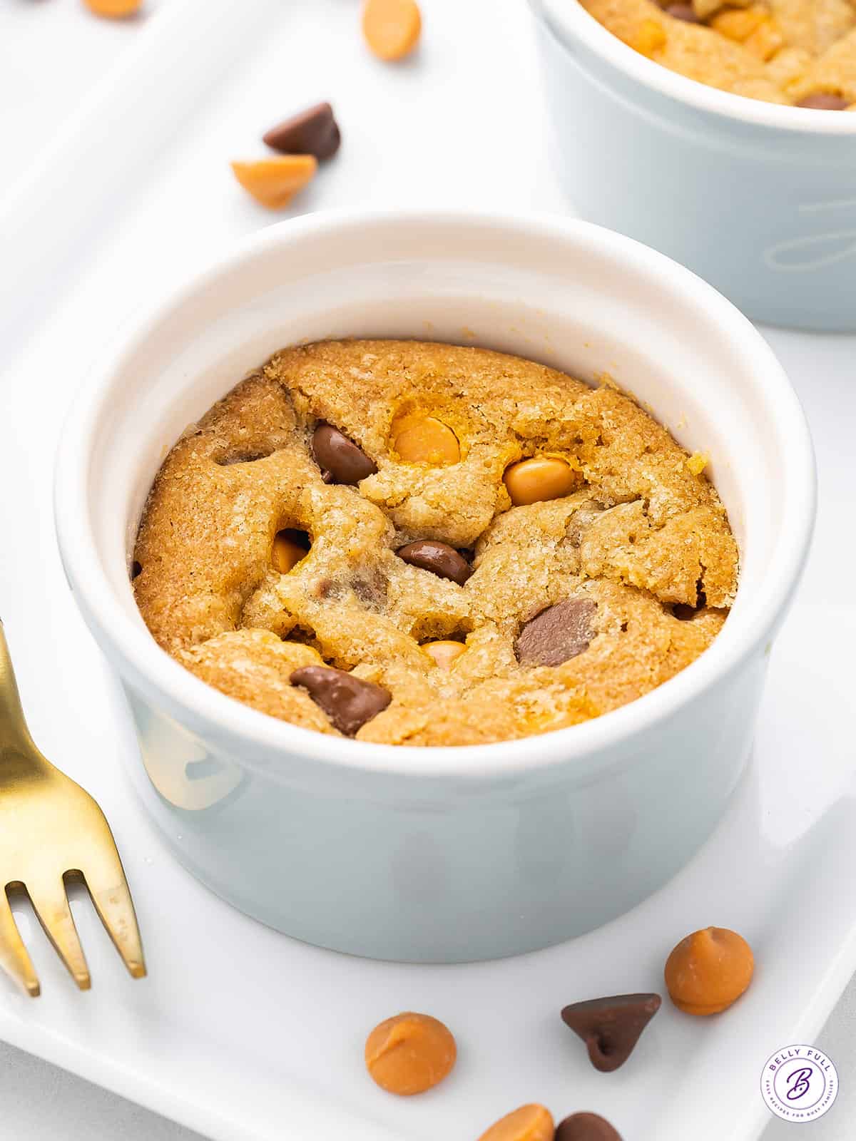 close up deep dish chocolate chip cookie on plate