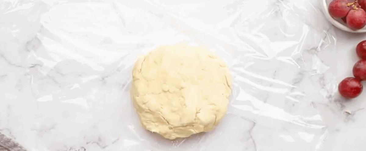 Pie crust dough shaped into a disc.