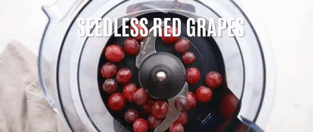 Red grapes in a food processor.
