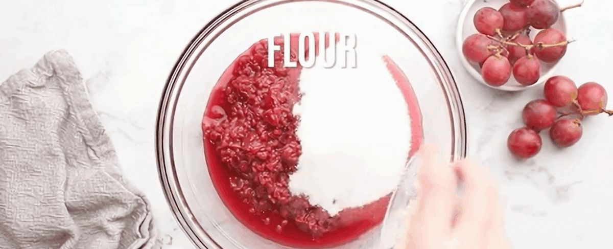 Adding the remaining filling ingredients to the cooled grapes.