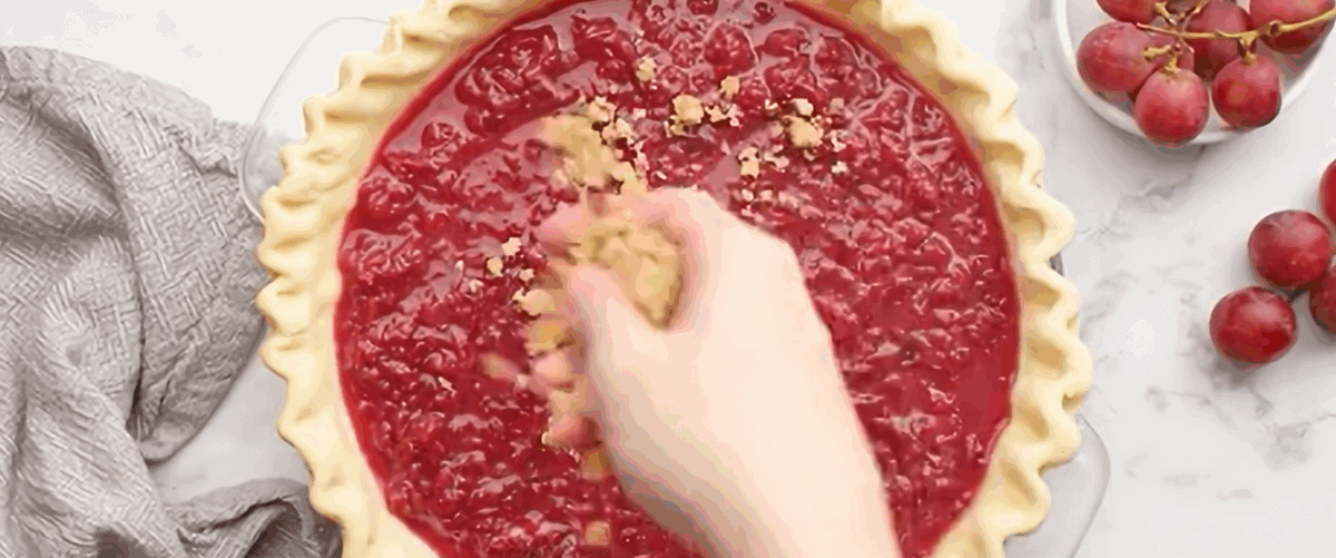 Assembling the grape pie.