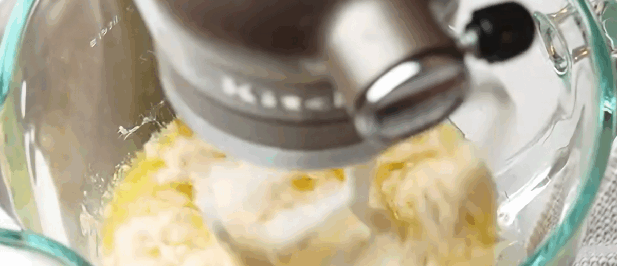 Combining all the ingredients to make the dough in a stand mixer.
