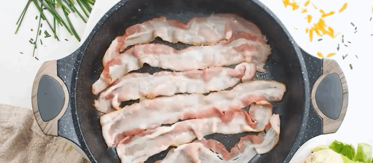 Cooking bacon in a skillet.