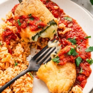 deep fried poblano cheese stuffed pepper cut open with fork