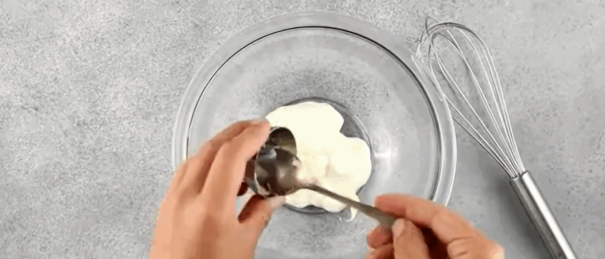 Making the dressing for the salad.