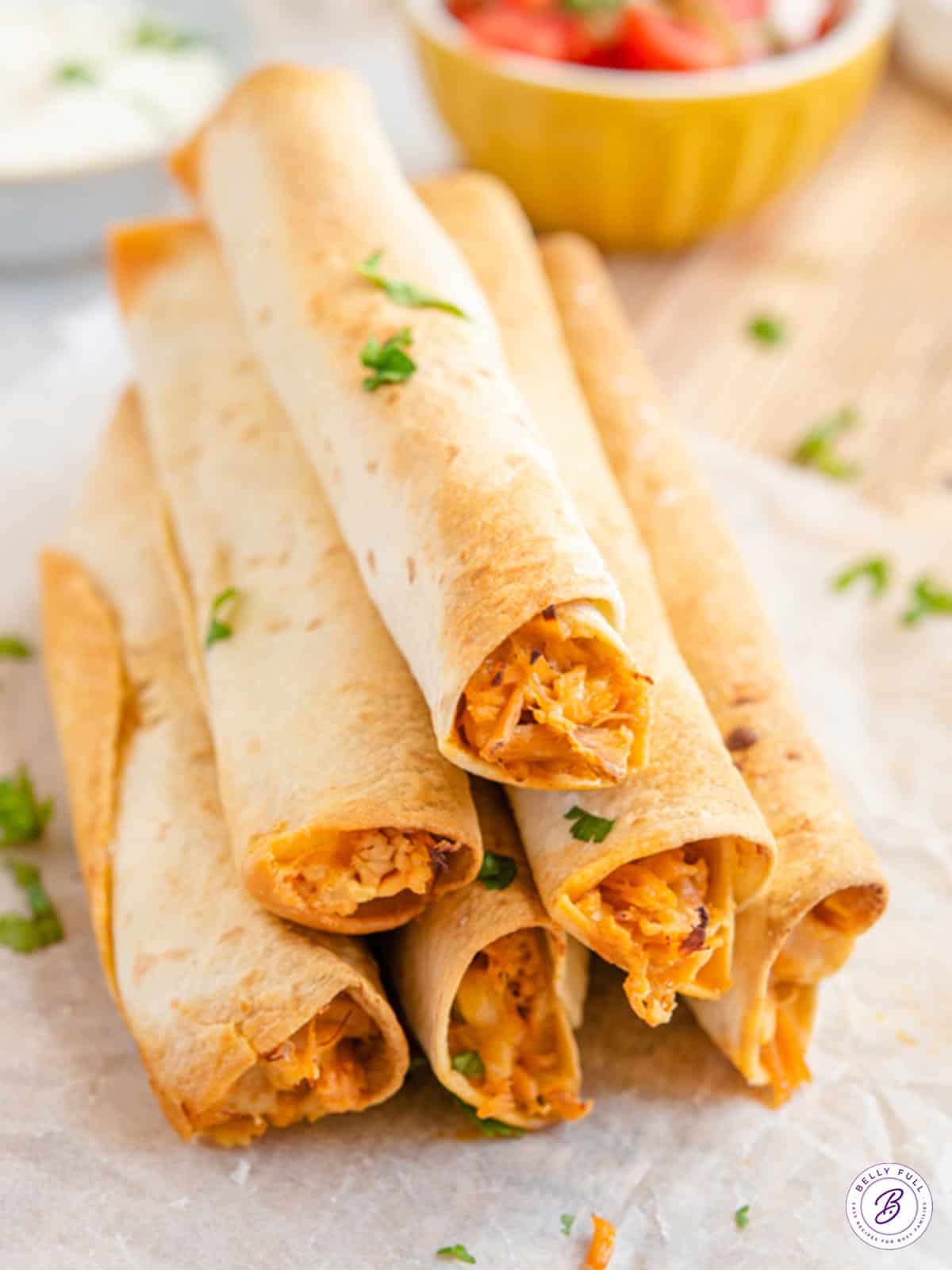 pyramid stack of baked Pulled Pork Taquitos