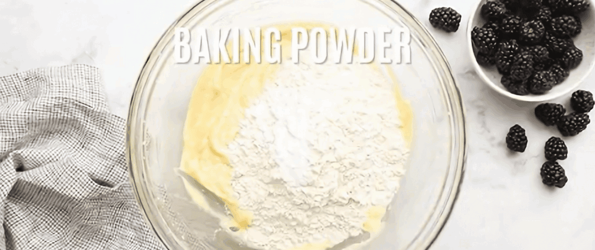 Adding dry ingredients to the batter.