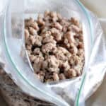 seasoned cooked ground meat crumbles in plastic bag