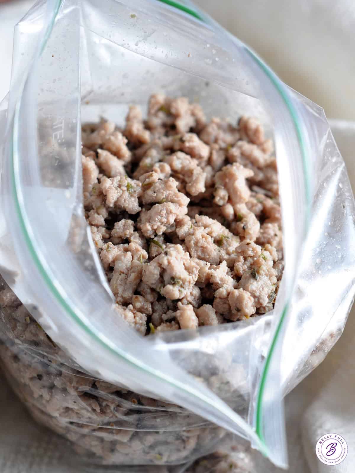 seasoned cooked ground meat crumbles in plastic bag