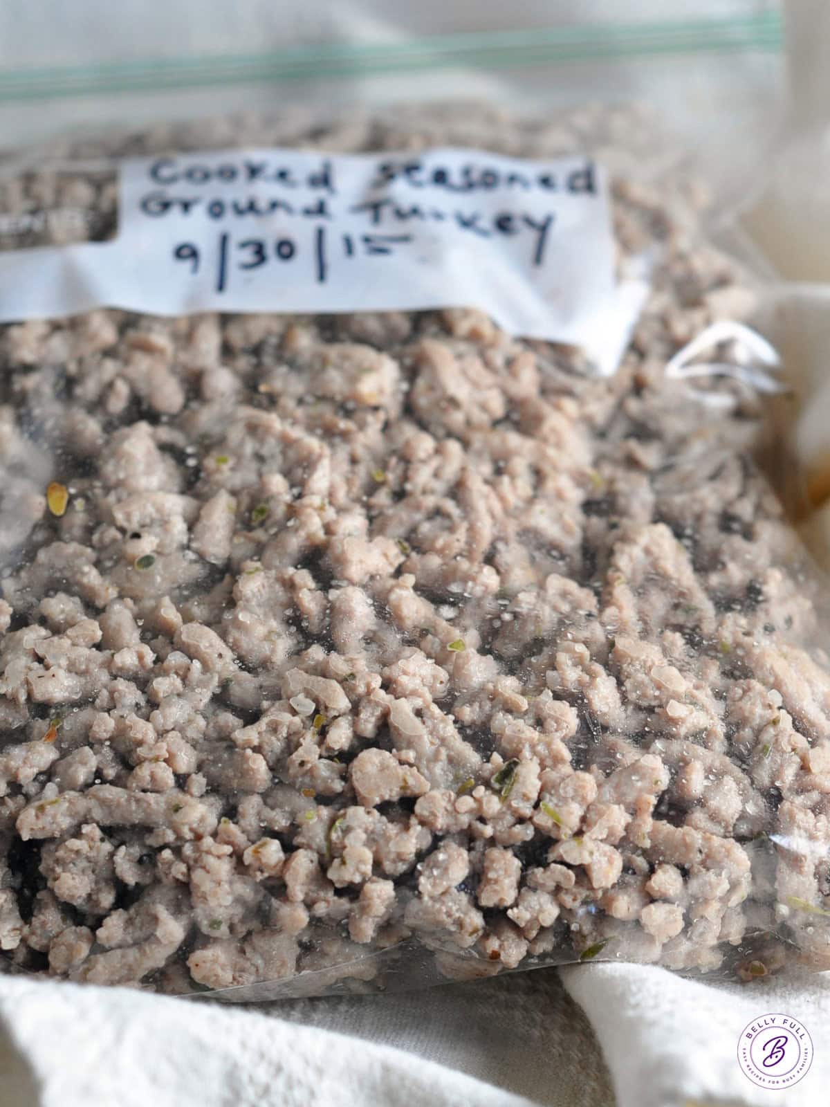 seasoned cooked ground turkey crumbles in plastic bag