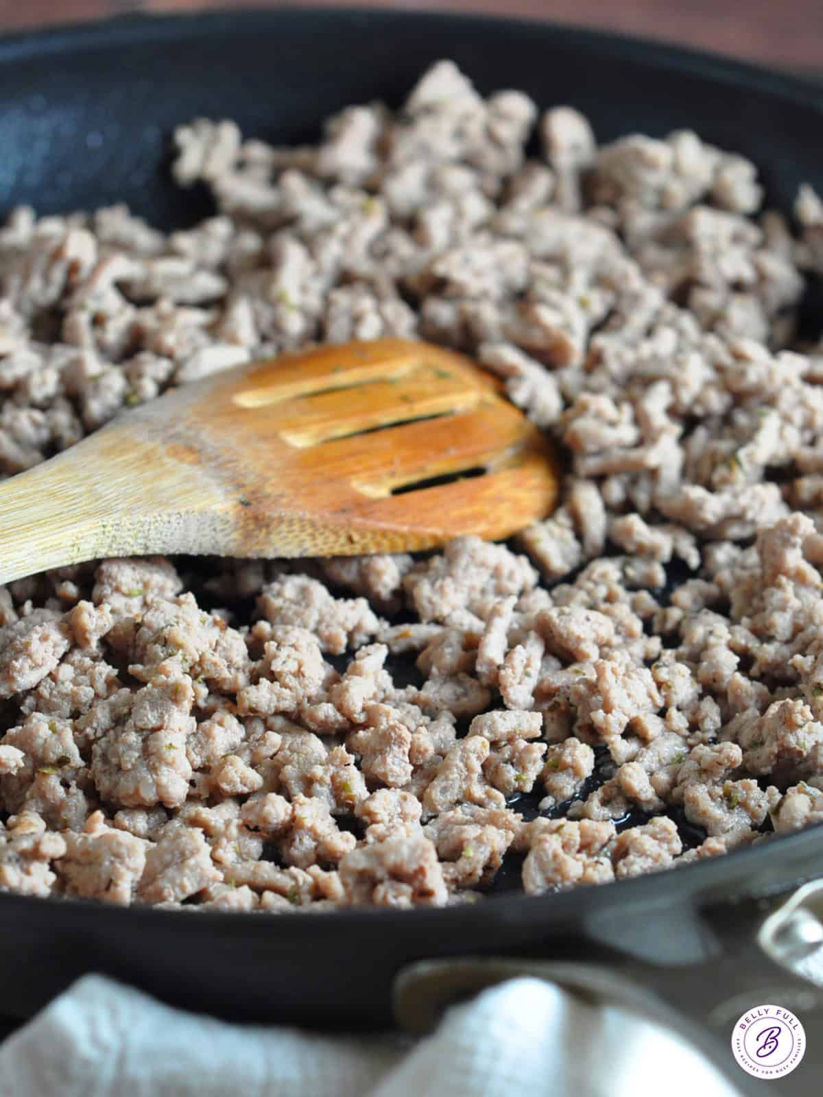 cooked ground turkey crumbles in skillet