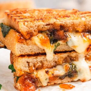 Bacon Jam Panini Cut in half with ooey gooey cheese