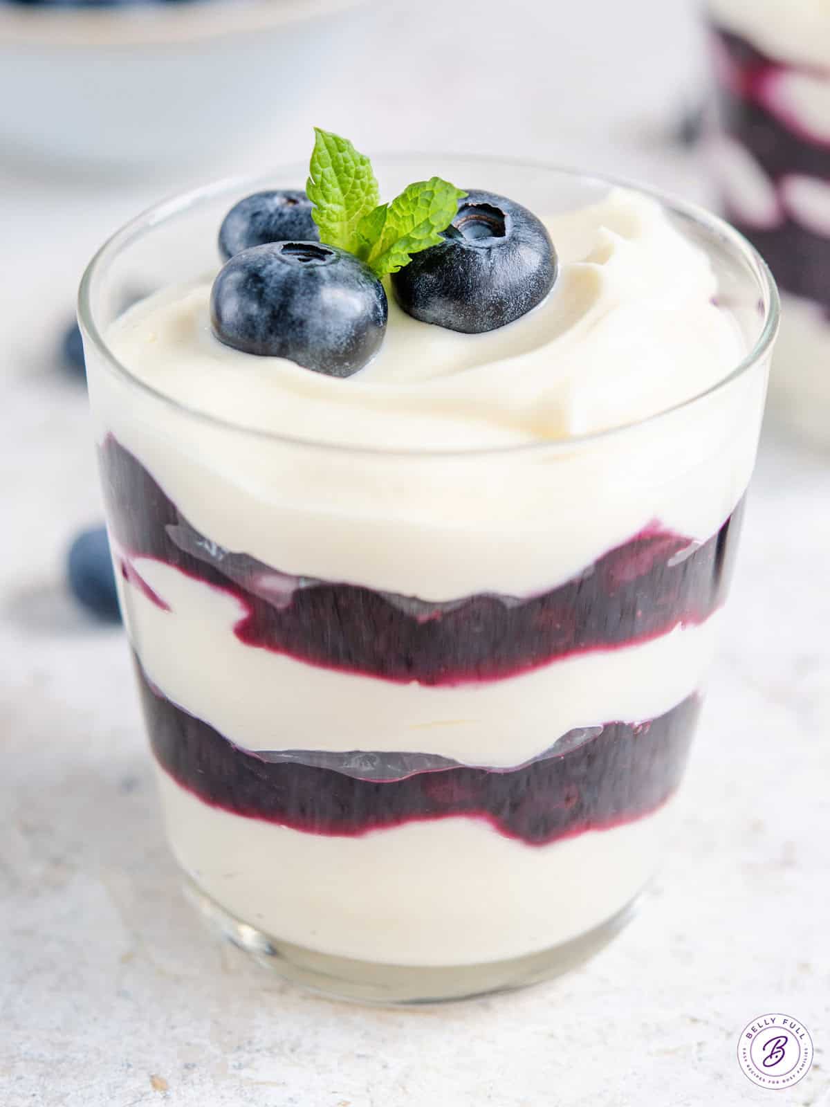 parfaits layered with blueberry sauce and cheesecake filling