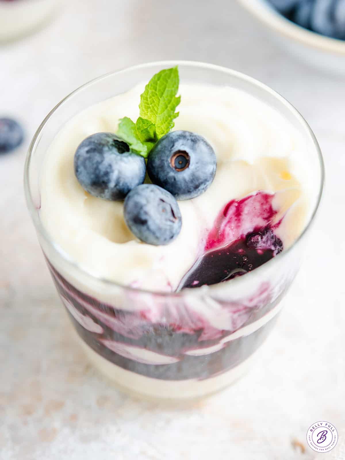 blueberry cheesecake parfaits topped with fresh blueberries