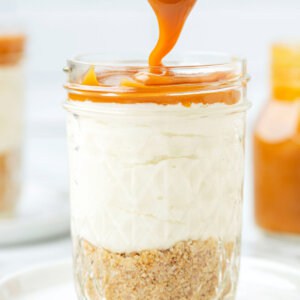 Salted caramel being added to a cheesecake jar